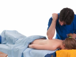 Massage therapist administering to a client. Elbow technique applied on back.